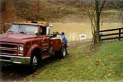 The Wrecker pulling a pickup out of a pond